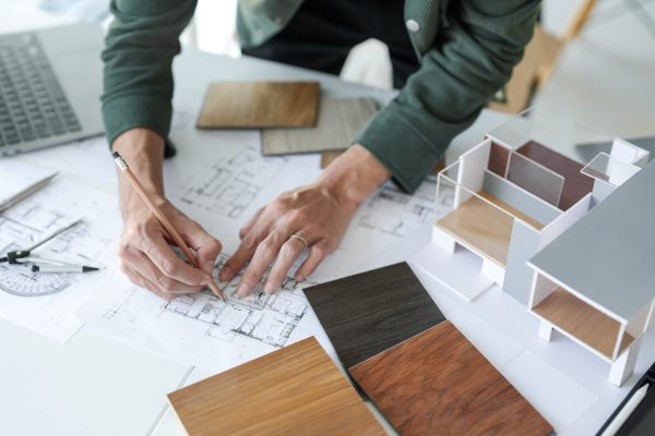 Architecture interior Man Creative project plan designer home and Choose interior materials  drawing interior on blueprint 